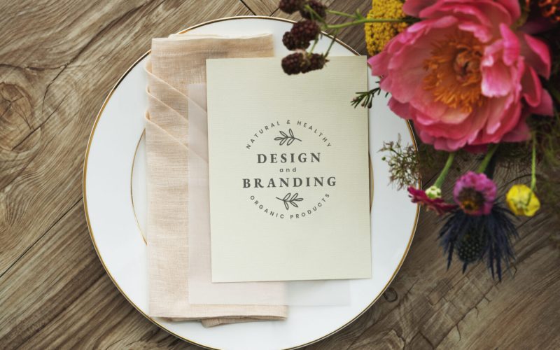 Flowers bouquet with  a card mockup on a white plate